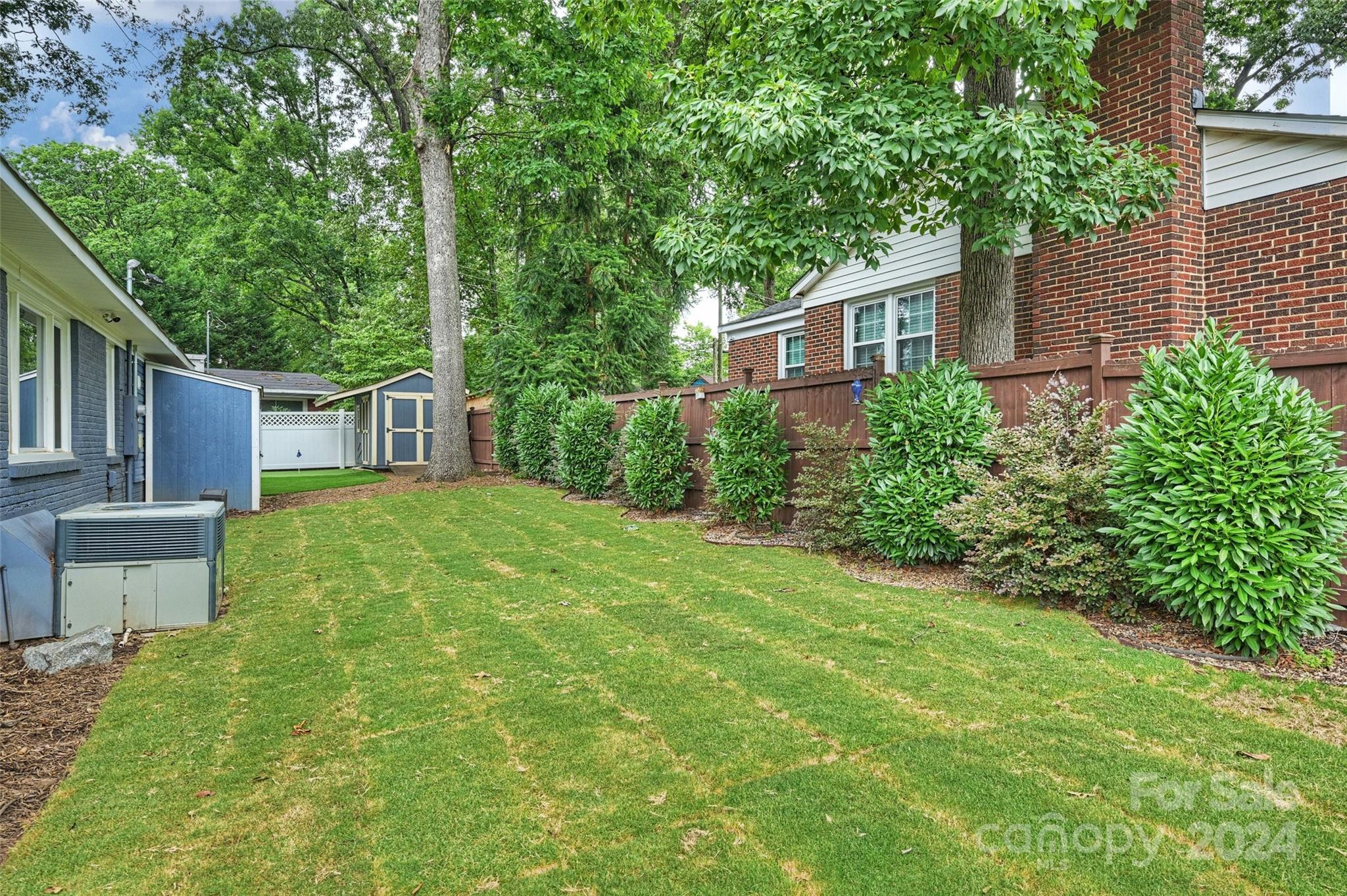 515 Bartling Road Charlotte, NC 28209 - Photo 40 of 42 a view of a house with yard and a garden