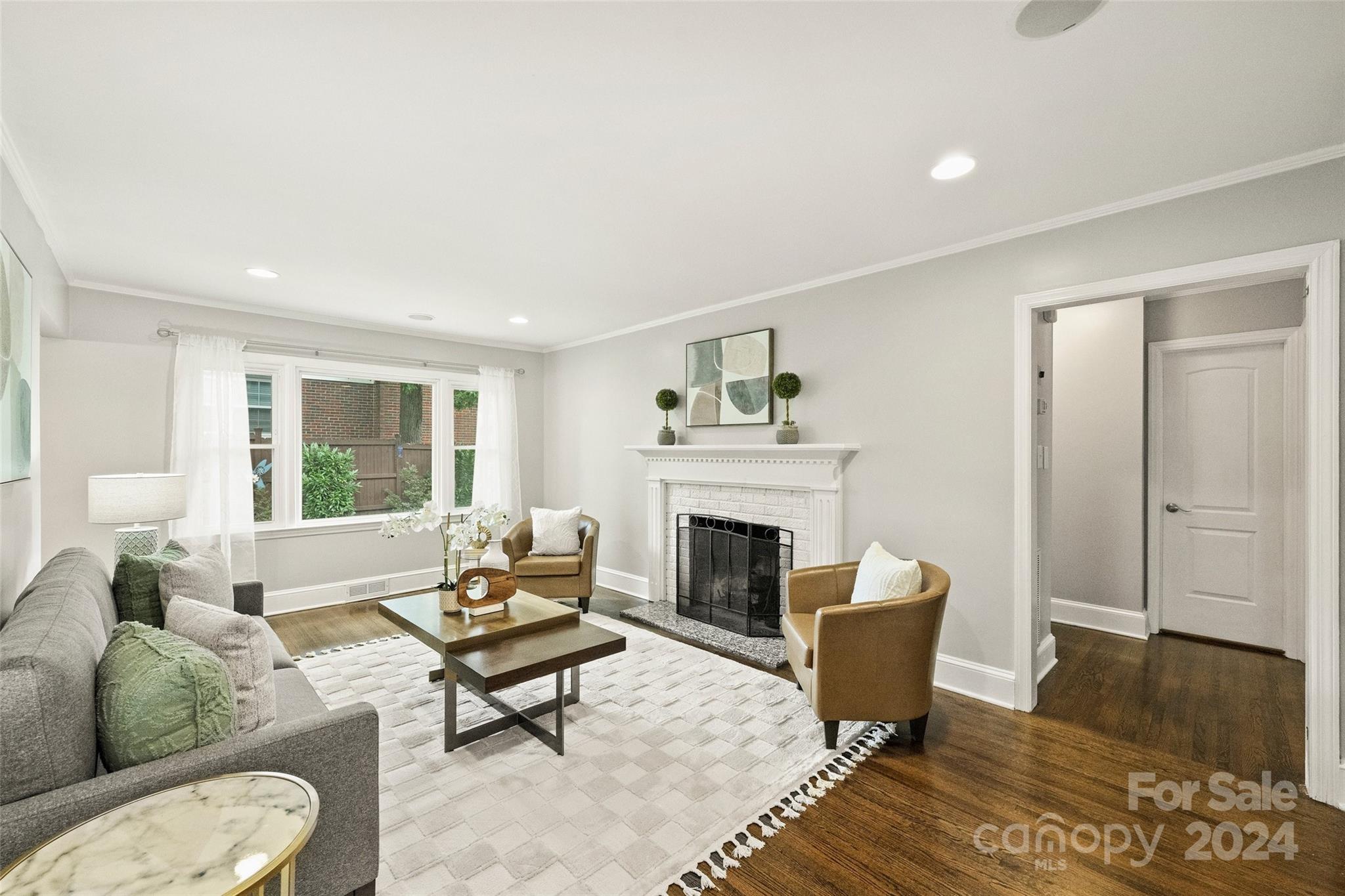 515 Bartling Road Charlotte, NC 28209 - Photo 4 of 42 a living room with furniture and a fireplace
