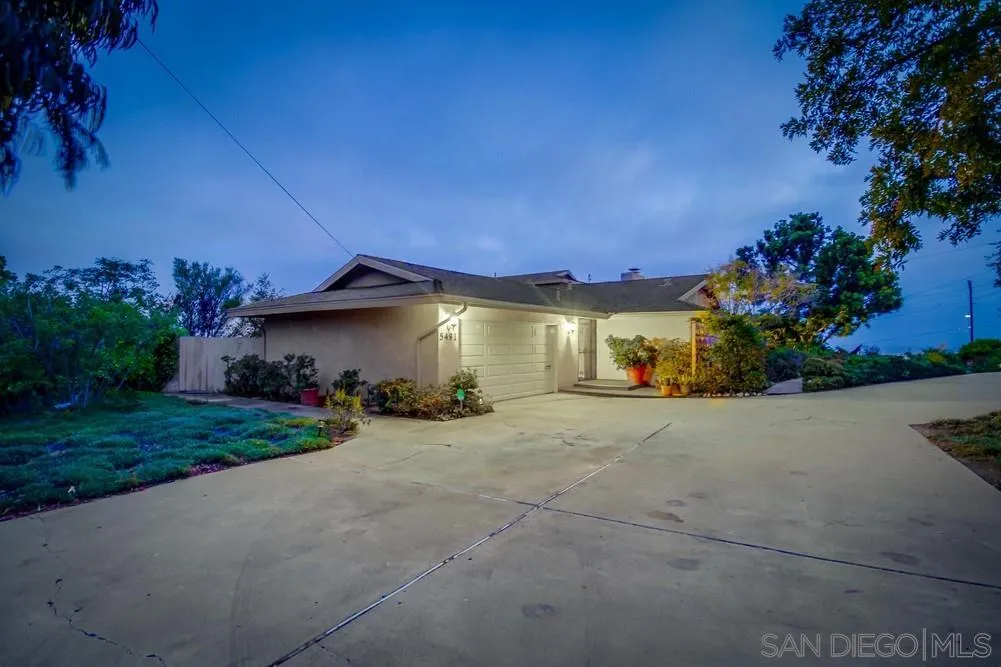 5491 Soledad Road La Jolla, CA 92037 - Photo 4 of 63 a view of a house with a yard and garage
