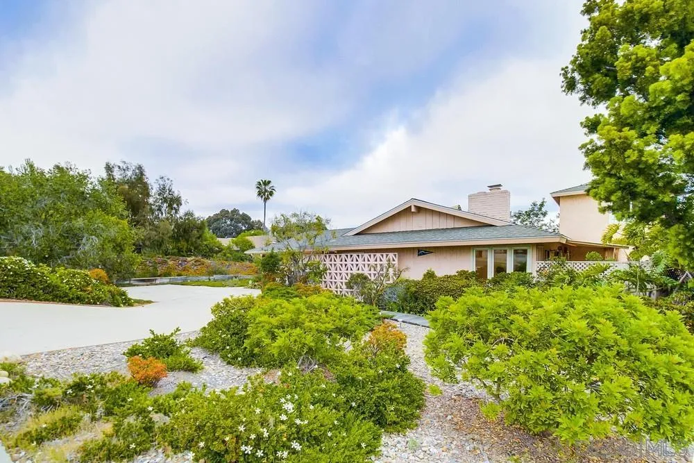 5491 Soledad Road La Jolla, CA 92037 - Photo 54 of 63 a front view of a house with a yard and lake view