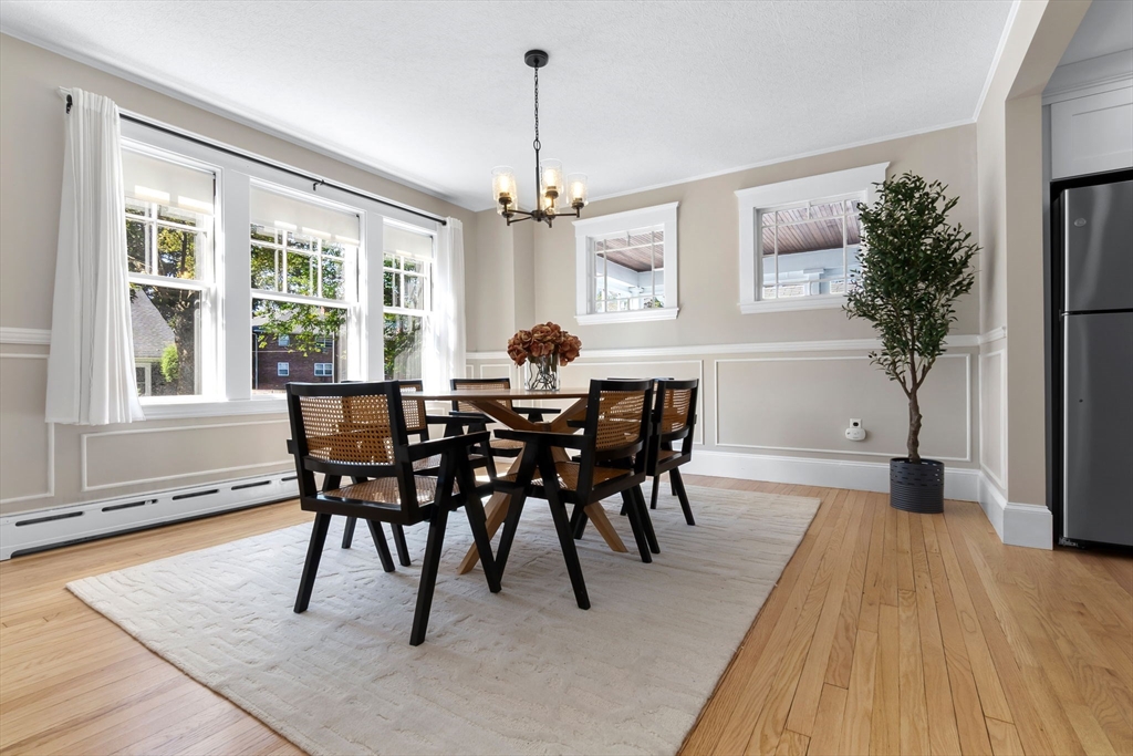17 Coolidge Street Stoneham, MA 02180 - Photo 13 of 37 a view of a dining room with furniture window and wooden floor
