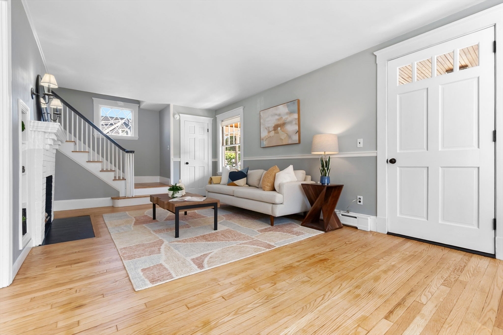 17 Coolidge Street Stoneham, MA 02180 - Photo 15 of 37 a living room with furniture and a wooden floor