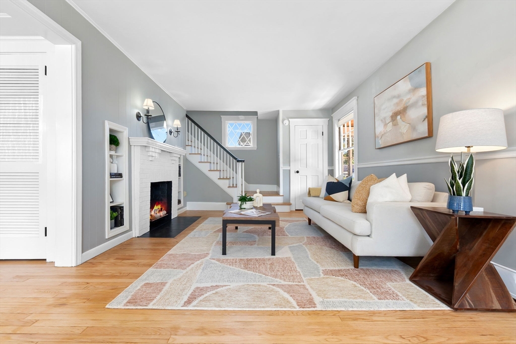 17 Coolidge Street Stoneham, MA 02180 - Photo 16 of 37 a living room with furniture and a wooden floor