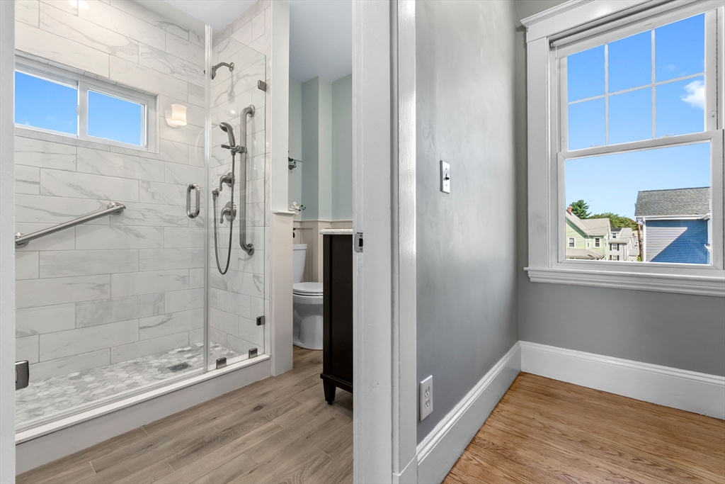 17 Coolidge Street Stoneham, MA 02180 - Photo 25 of 37 a bathroom with a bathtub and shower