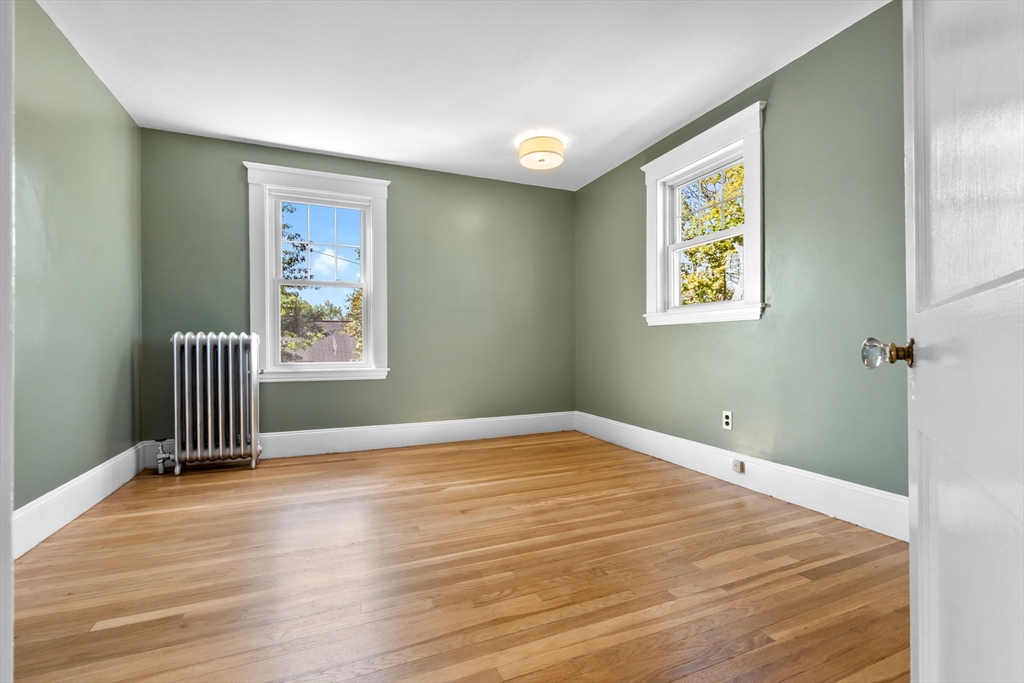 17 Coolidge Street Stoneham, MA 02180 - Photo 27 of 37 a view of empty room with wooden floor and fan