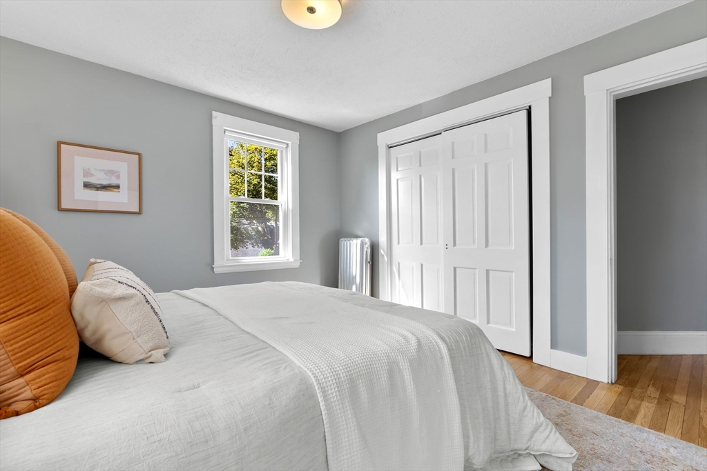 17 Coolidge Street Stoneham, MA 02180 - Photo 30 of 37 a bedroom with a bed and a window