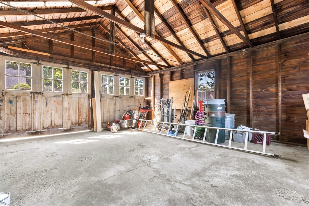 17 Coolidge Street Stoneham, MA 02180 - Photo 34 of 37 a view of a room with wooden floor and windows