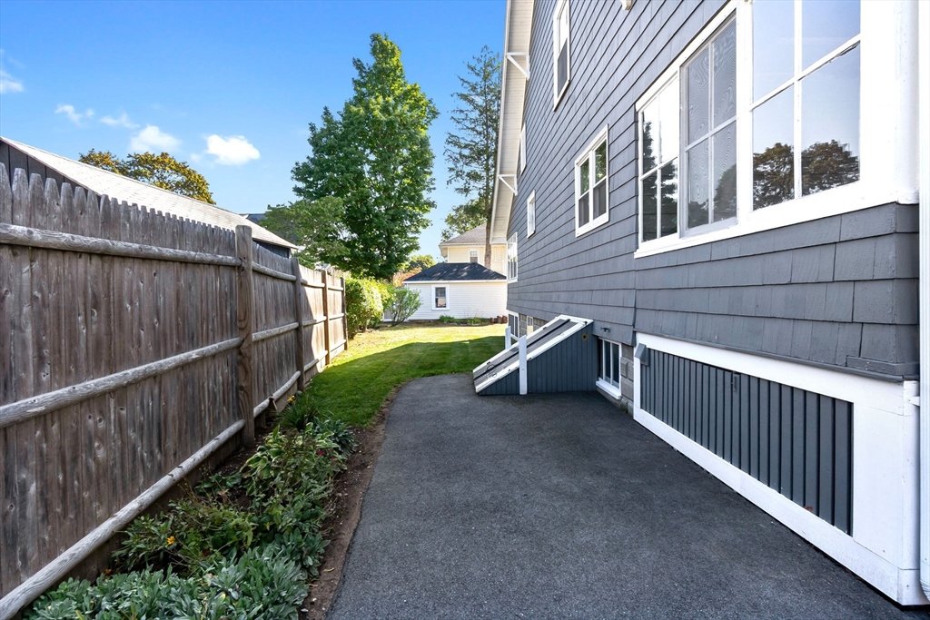 17 Coolidge Street Stoneham, MA 02180 - Photo 36 of 37 a view of a backyard with wooden fence