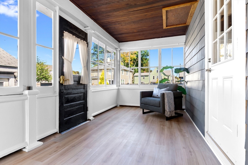 17 Coolidge Street Stoneham, MA 02180 - Photo 5 of 37 a living room with furniture and a wooden floor