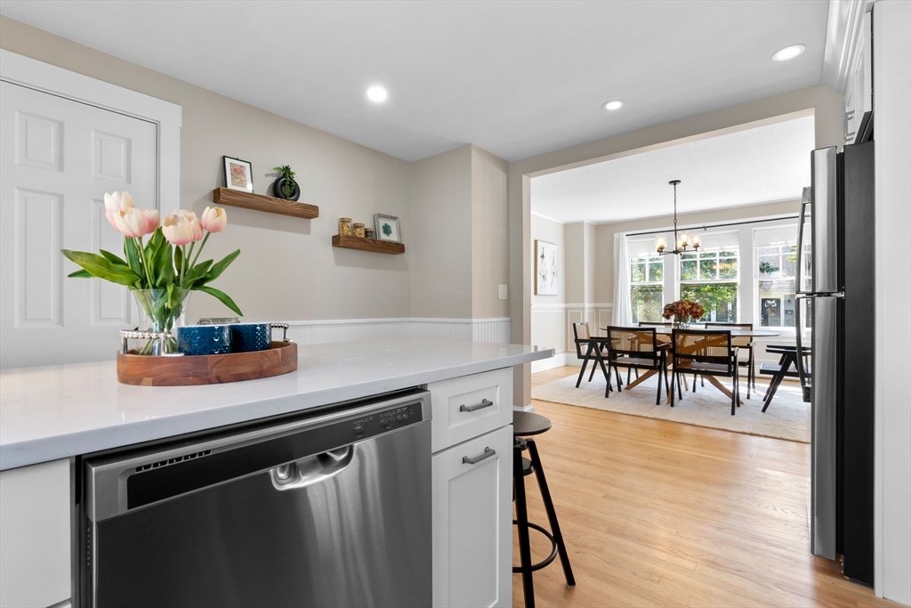 17 Coolidge Street Stoneham, MA 02180 - Photo 10 of 37 a kitchen with a potted plant on the counter and cabinets