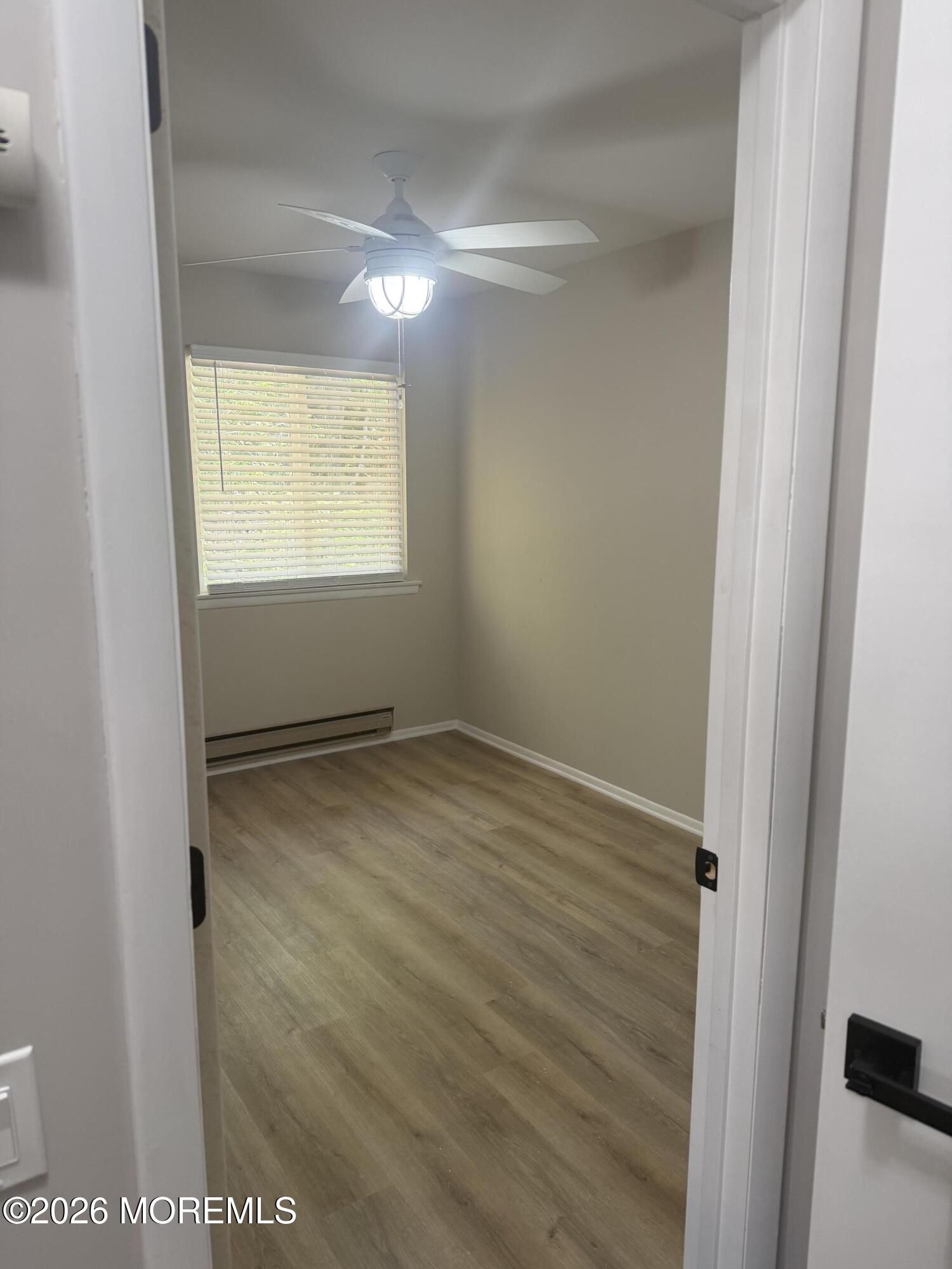31 Homestead Drive, Unit A Whiting, NJ 08759 - Photo 5 of 23 a view of an empty room with a window