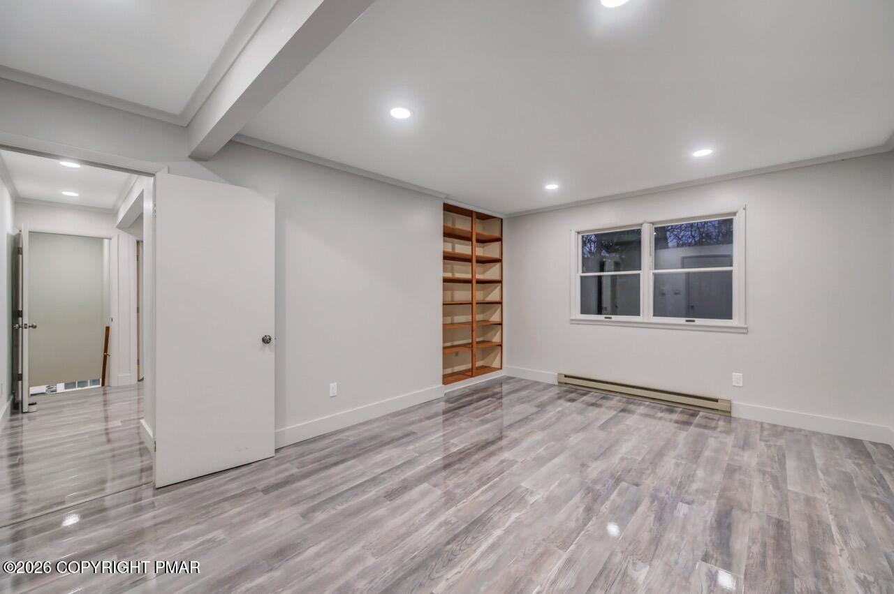 384 Devils Hole Road Cresco, PA 18326 - Photo 69 of 97 a view of empty room with wooden floor and window