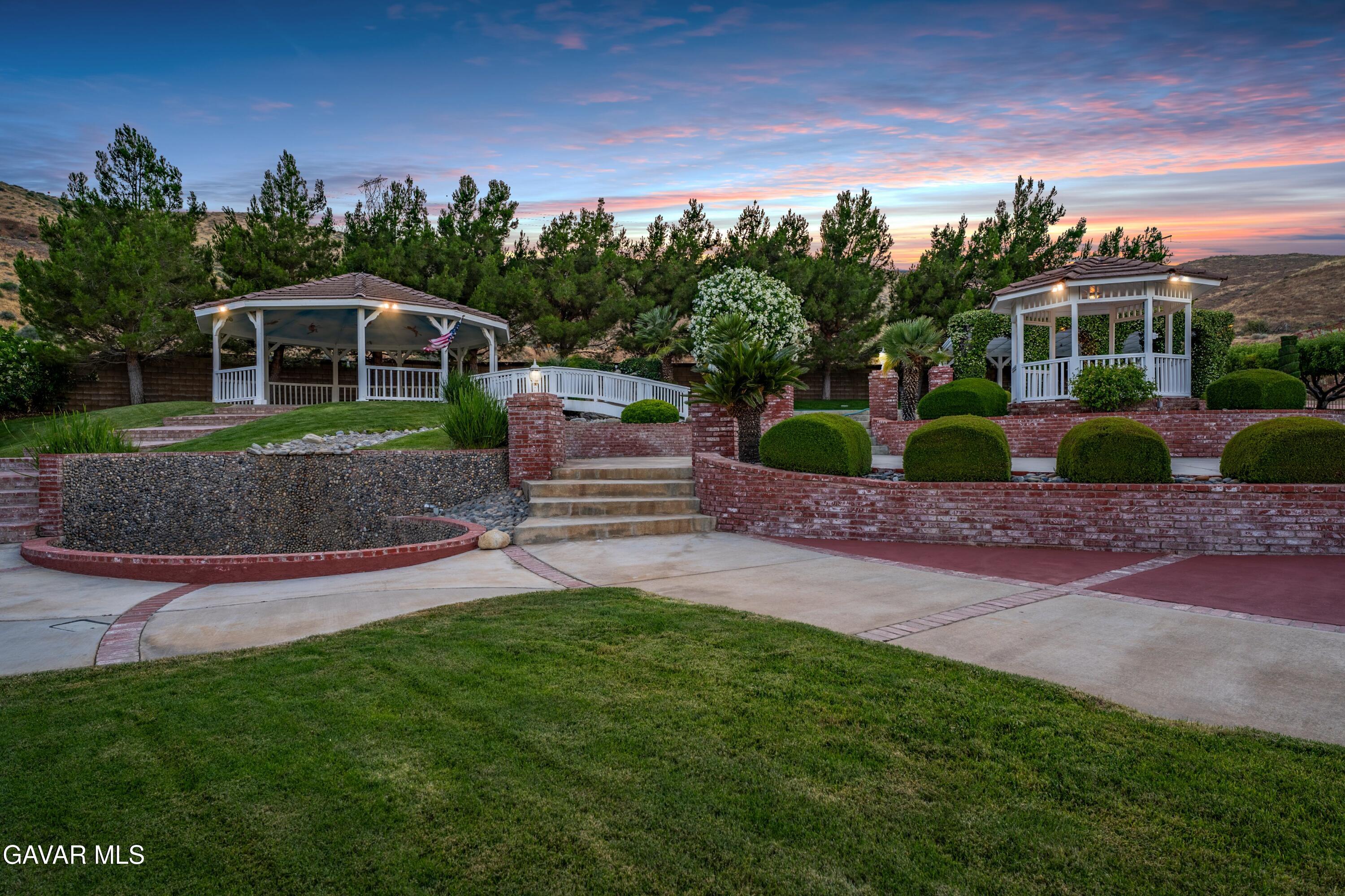 5801 Hacienda Ranch Road Palmdale, CA 93551 - Photo 6 of 69 a front view of a house with a yard