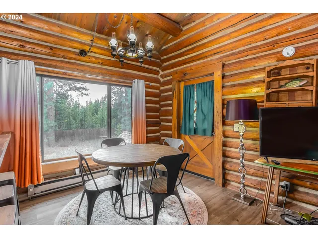 a dining room with furniture and window