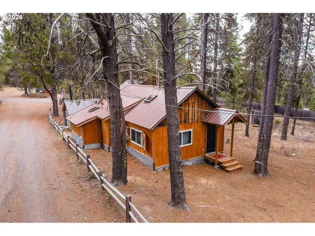 a kitchen with refrigerator cabinets and furniture