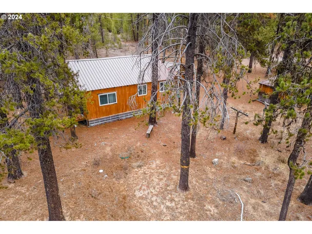 a kitchen with stainless steel appliances a sink and a microwave