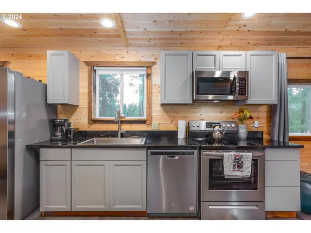 a living room with fireplace furniture and a flat screen tv