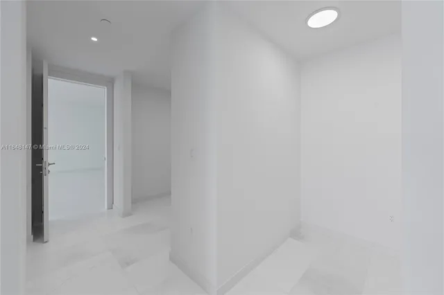 an empty room with sliding glass door