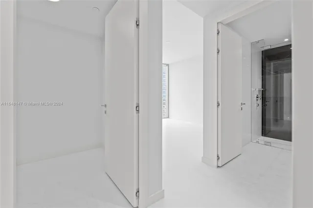 a view of a patio with a table and chairs