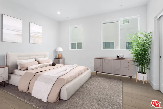 a bed room with a bed and a window