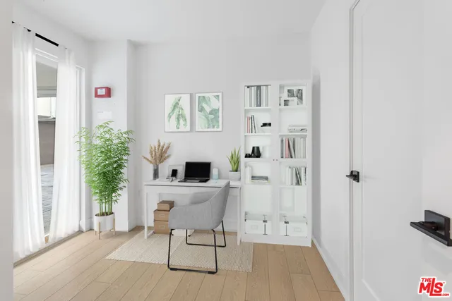a living room with furniture a fireplace and a window