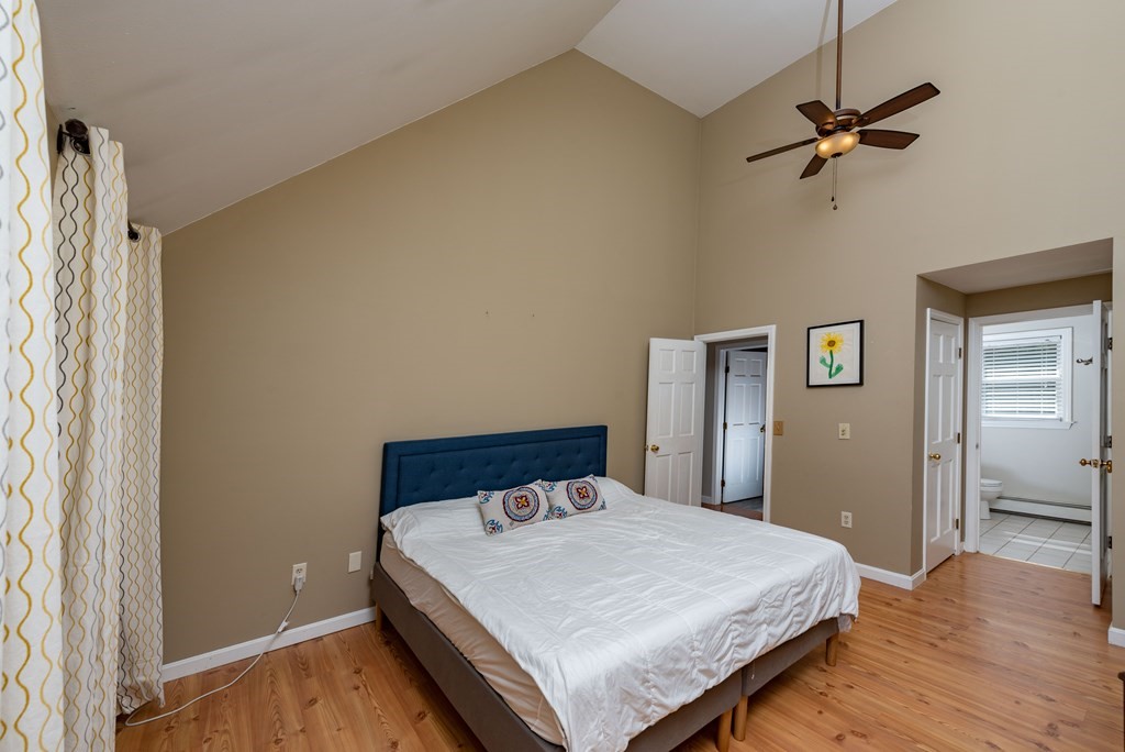 49 Point Of Pines Road Freetown, MA 02717 - Photo 11 of 32 a bedroom with a bed and a ceiling fan