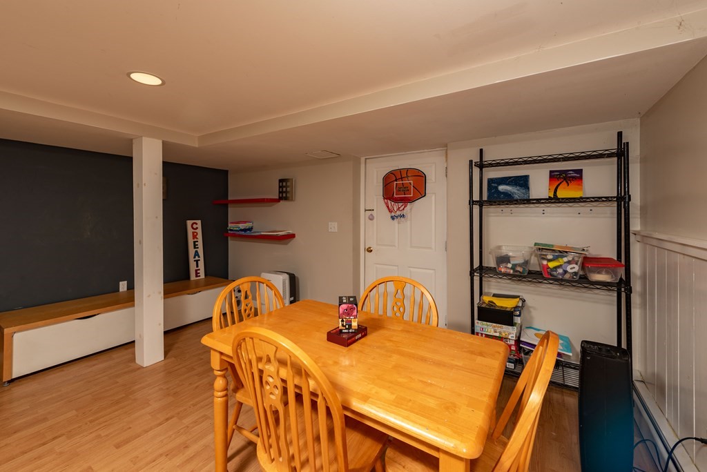 49 Point Of Pines Road Freetown, MA 02717 - Photo 21 of 32 a bedroom with a bed and wooden floor