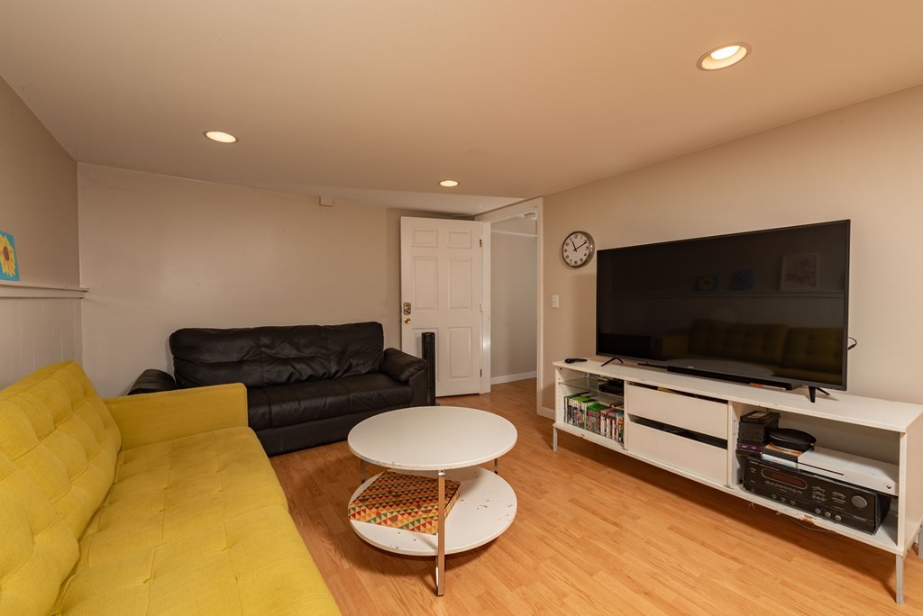 49 Point Of Pines Road Freetown, MA 02717 - Photo 23 of 32 a living room with furniture and a flat screen tv