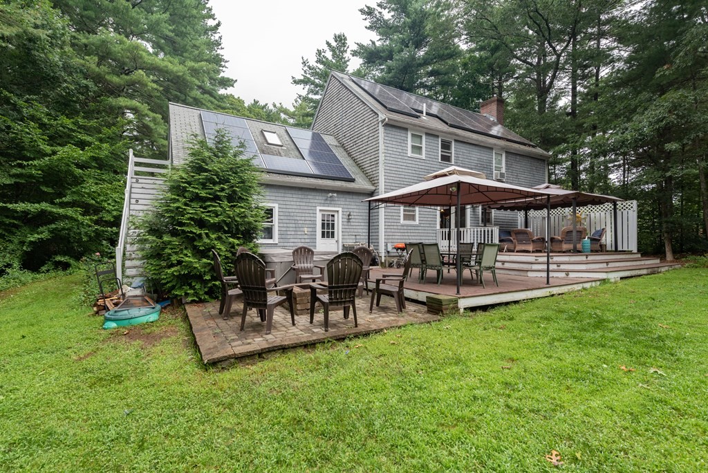 49 Point Of Pines Road Freetown, MA 02717 - Photo 27 of 32 a patio with table and chairs