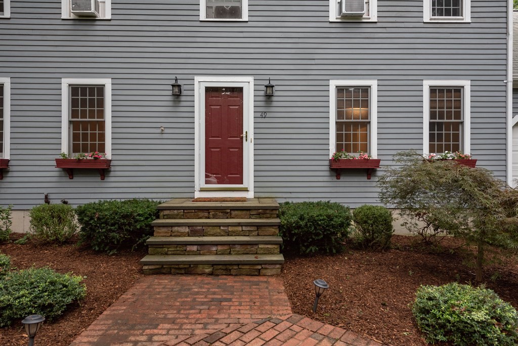 49 Point Of Pines Road Freetown, MA 02717 - Photo 31 of 32 a front view of a house with a garden