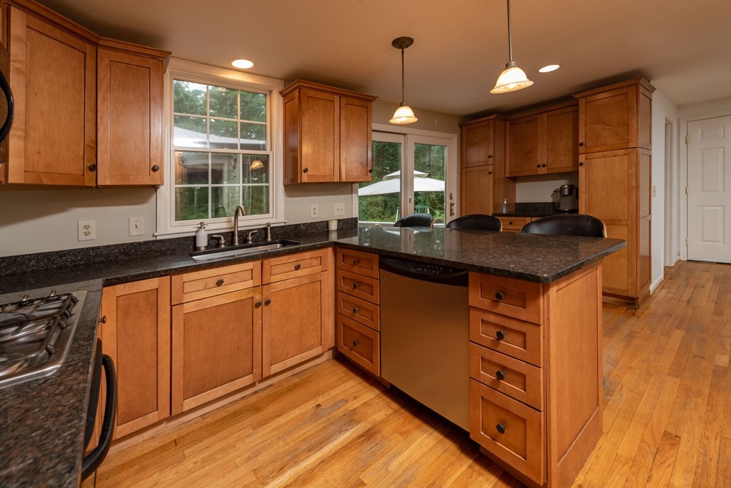 49 Point Of Pines Road Freetown, MA 02717 - Photo 5 of 32 a kitchen with stainless steel appliances granite countertop a sink stove and cabinets