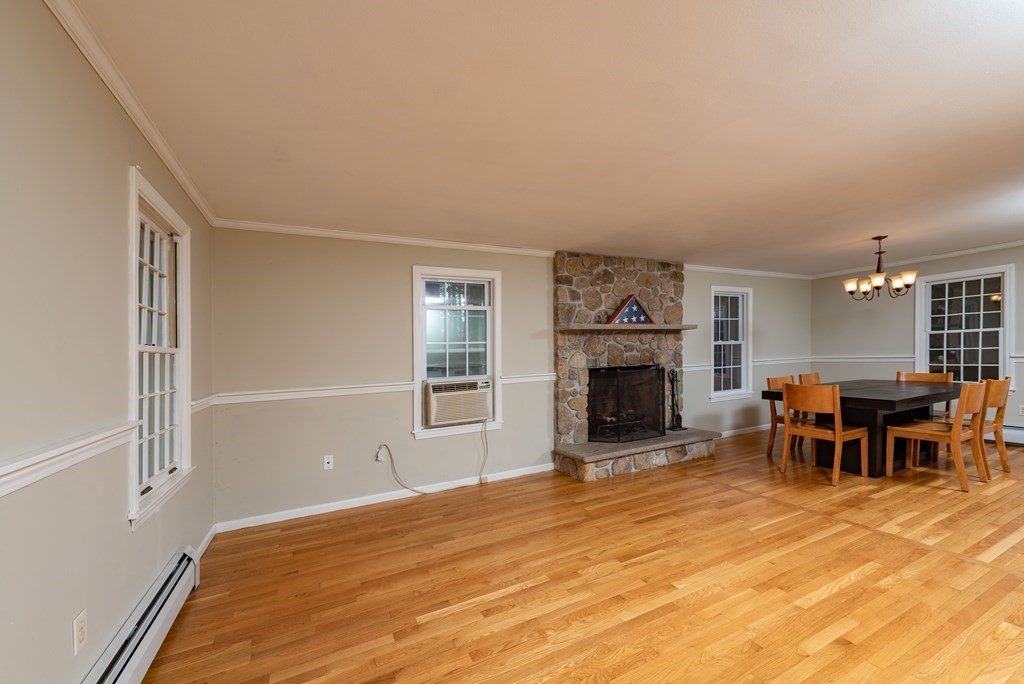 49 Point Of Pines Road Freetown, MA 02717 - Photo 7 of 32 a view of a livingroom with furniture and a fireplace