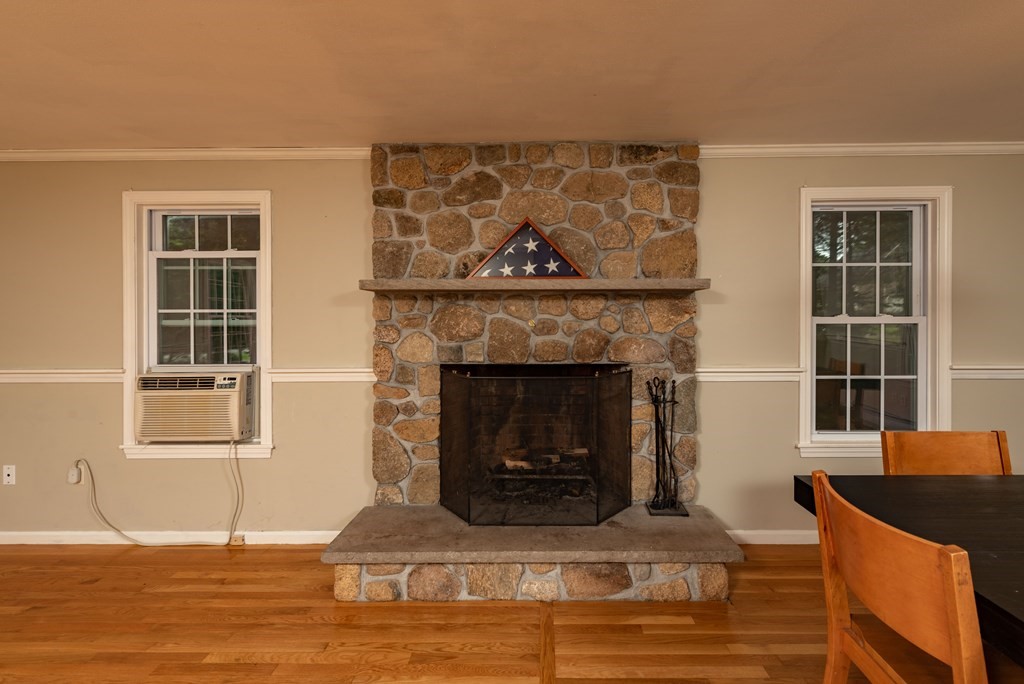 49 Point Of Pines Road Freetown, MA 02717 - Photo 8 of 32 a living room with furniture and a fireplace