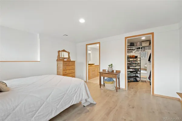 a bedroom with a bed and a table in it