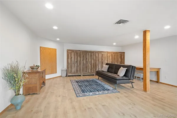 a living room with furniture and a rug