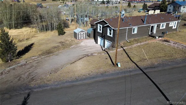 a view of swimming pool with sitting area