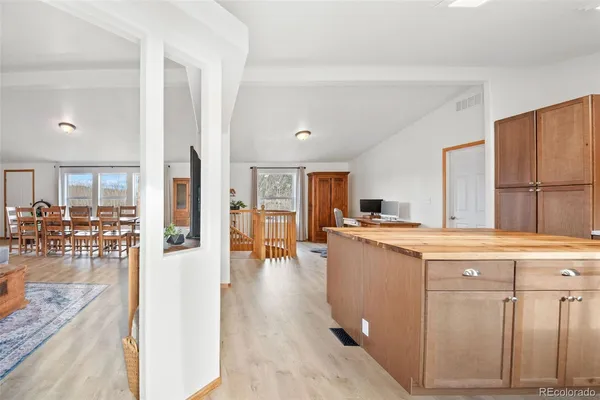 a kitchen with a sink a counter top space and stainless steel appliances