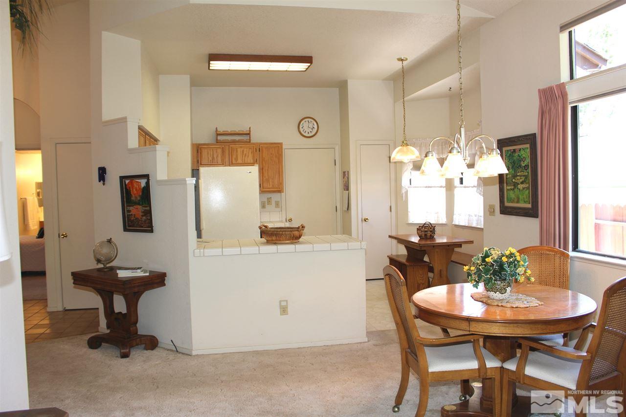 5830 Walnut Creek Road Reno, NV 89523 - Photo 18 of 37 a view of a dining room with furniture