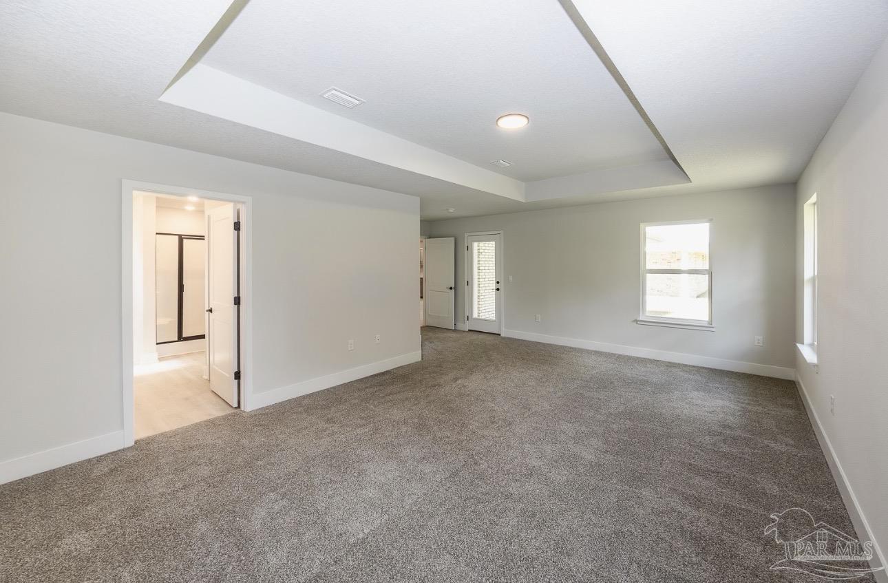 7657 Small Pnes Street Milton, FL 32583 - Photo 19 of 26 a view of an empty room with a window