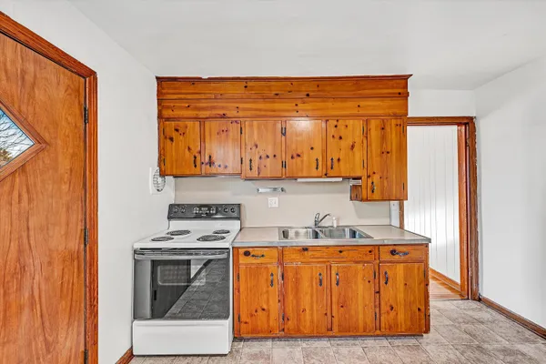 a kitchen with stainless steel appliances granite countertop a stove and a refrigerator