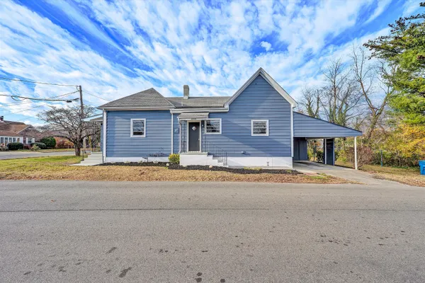 a house with trees in front of it