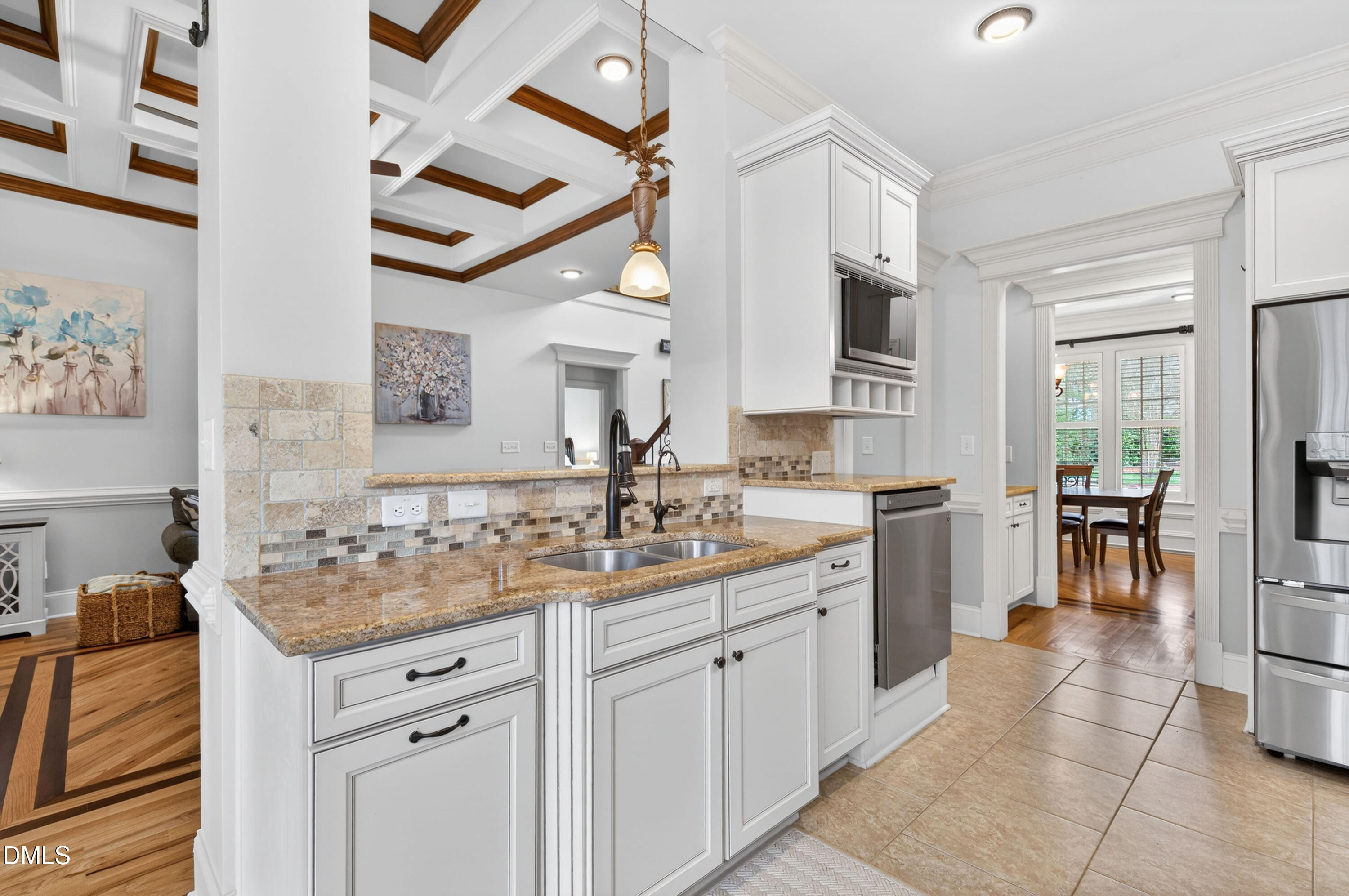 691 Hawthorne Place Creedmoor, NC 27522 - Photo 21 of 84 a kitchen with a sink and cabinets