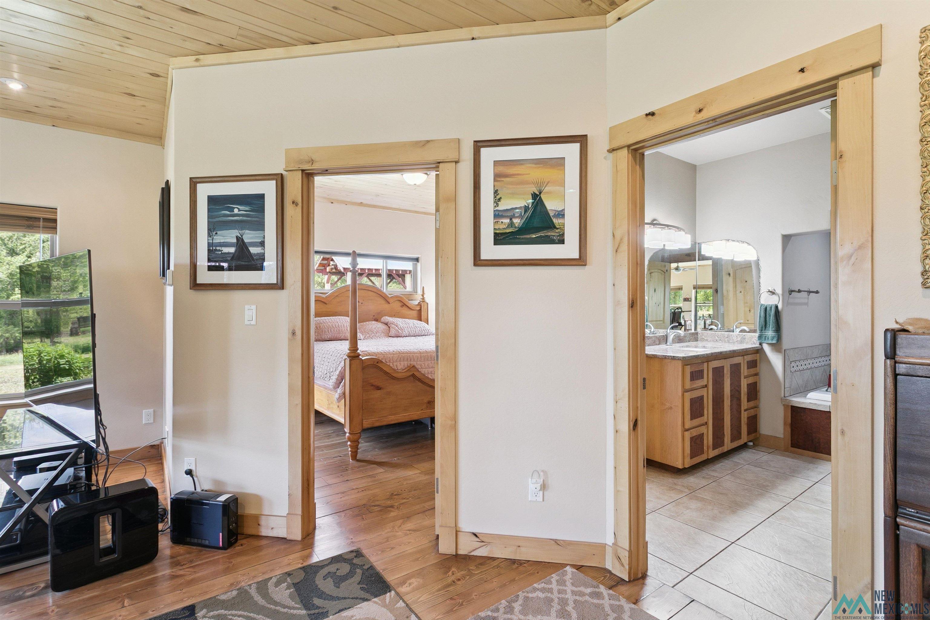 31 Cr 343 Road Chama, NM 87520 - Photo 17 of 44 Hall with wooden ceiling, light wood-type flooring, and ornamental molding
