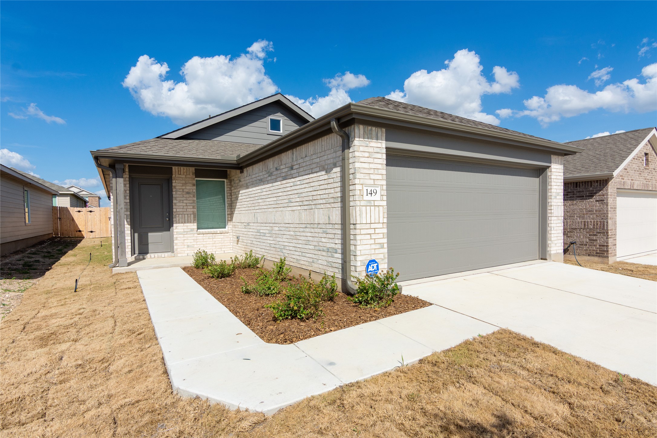 149 Star Packer Lane Jarrell, TX 76537 - Photo 1 of 30 A well-maintained facade with neat landscaping and a generous driveway offers inviting curb appeal.
