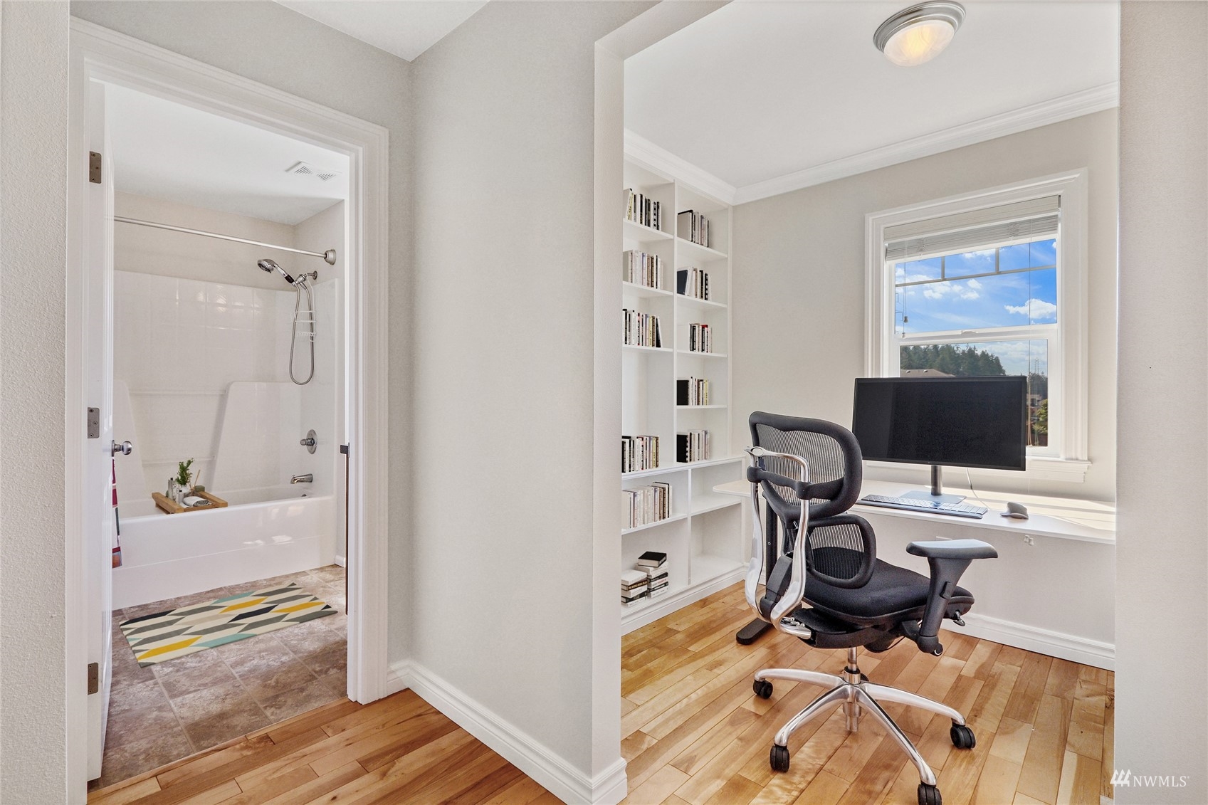 4203 167th Place Southeast Bothell, WA 98012 - Photo 23 of 38 a view of a workspace with furniture and a window