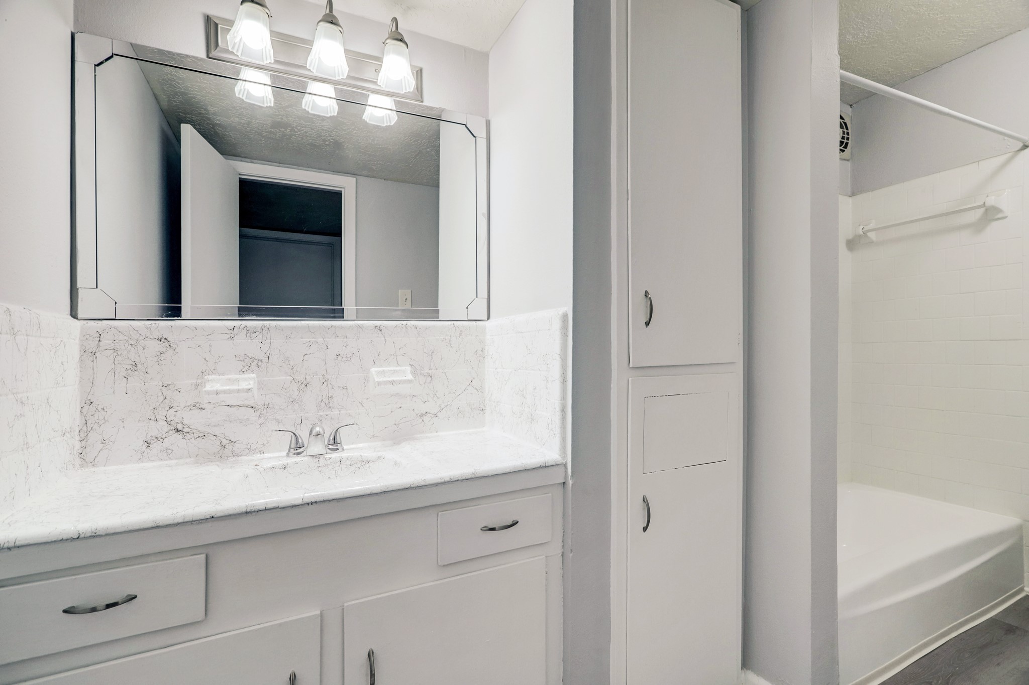 1645 West Main Street, Unit 13 Houston, TX 77006 - Photo 12 of 13 a bathroom with a sink and a mirror
