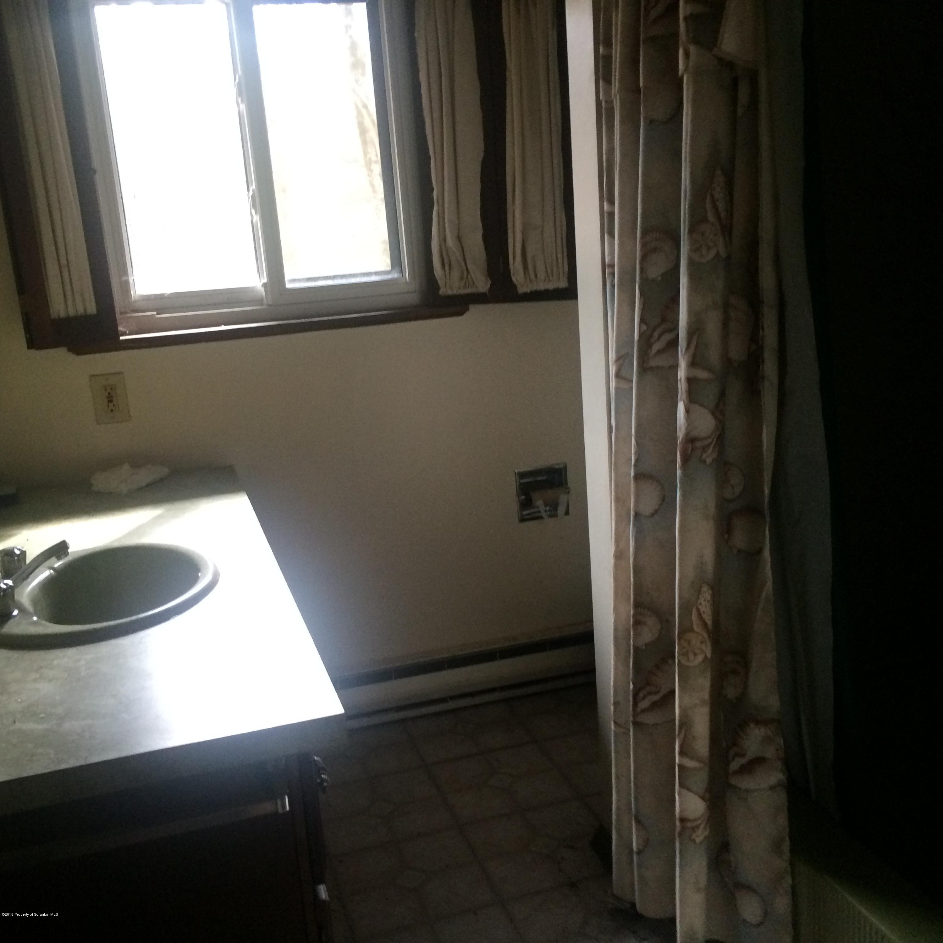 3322 Whengreen Road Nicholson, PA 18446 - Photo 10 of 15 a bathroom with a sink and a window