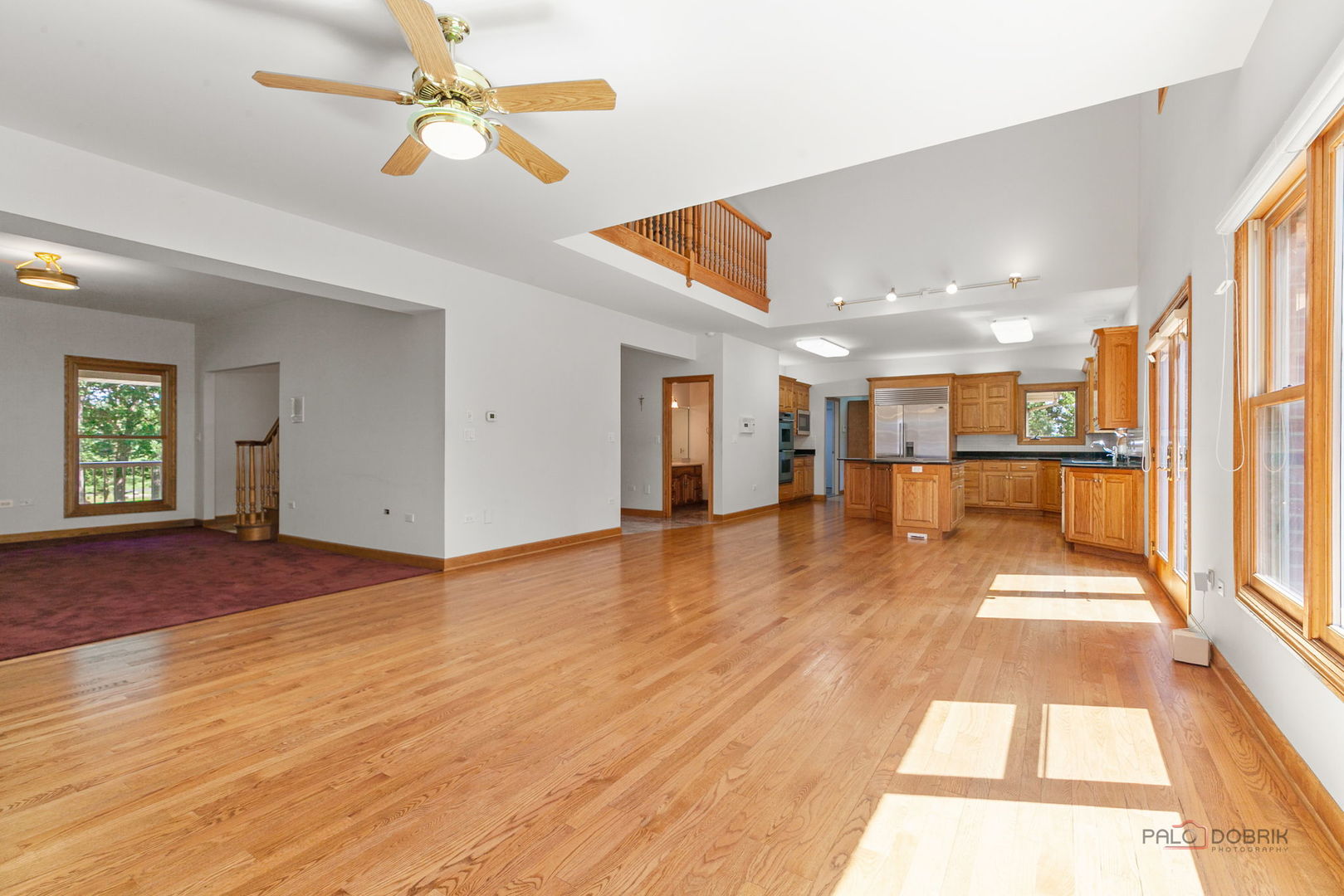 28232 North Gilmer Road Grayslake, IL 60030 - Photo 18 of 74 a view of a hall with wooden floor and a kitchen