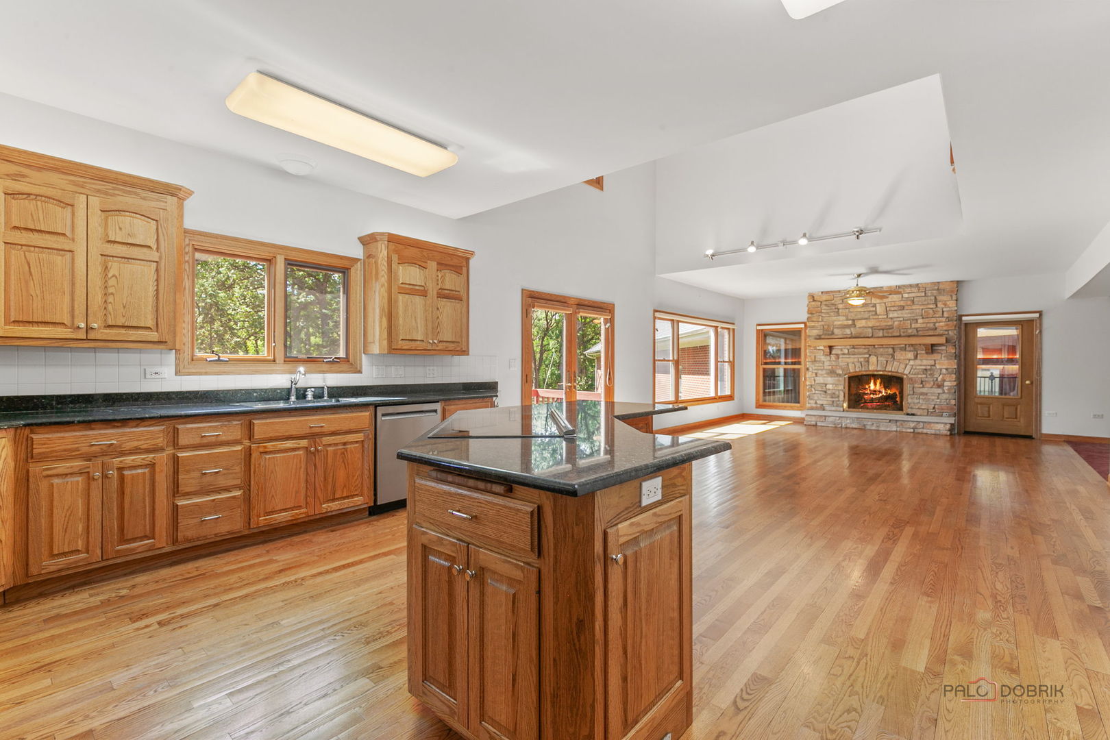 28232 North Gilmer Road Grayslake, IL 60030 - Photo 21 of 74 a kitchen with stainless steel appliances granite countertop a stove and wooden floors