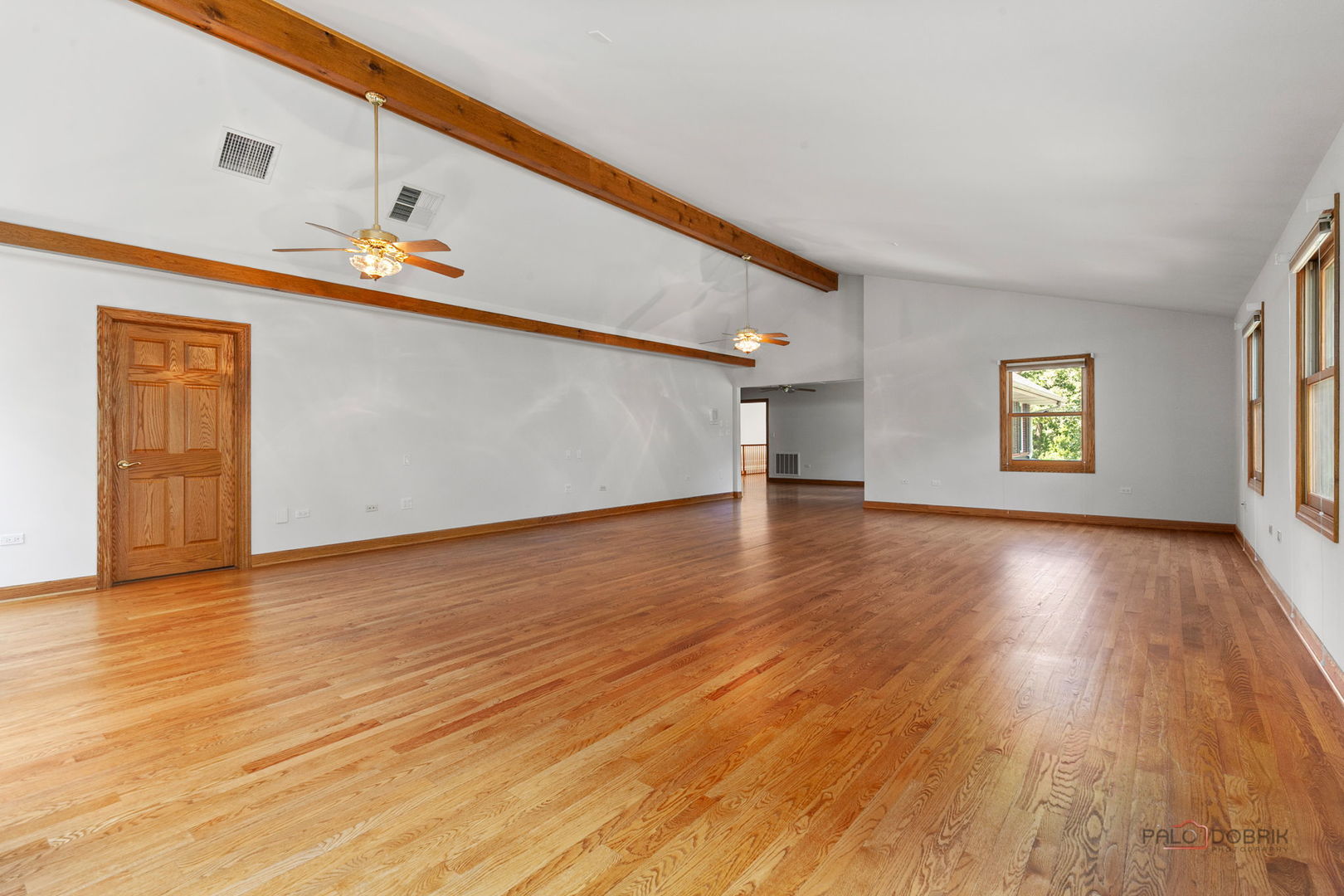 28232 North Gilmer Road Grayslake, IL 60030 - Photo 31 of 74 a view of an empty room with wooden floor and a window